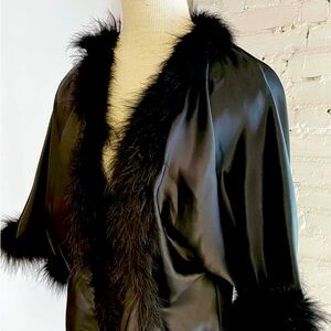 1970s Claire Haddad black short jacket with maribou trim.